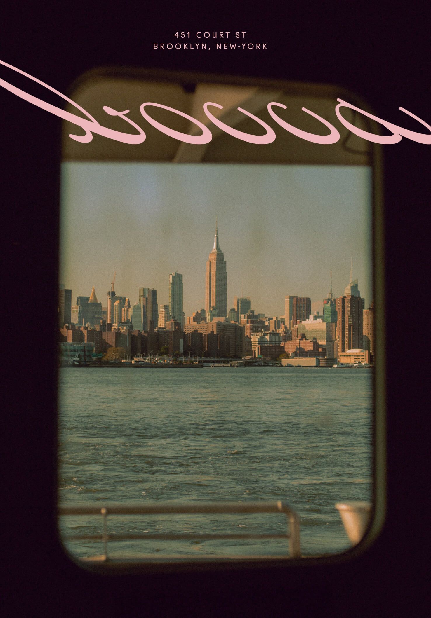 View through a round ferry or boat window showing the Manhattan skyline across the water, with the pink cursive "Bocca" logo and address curving across the glass.