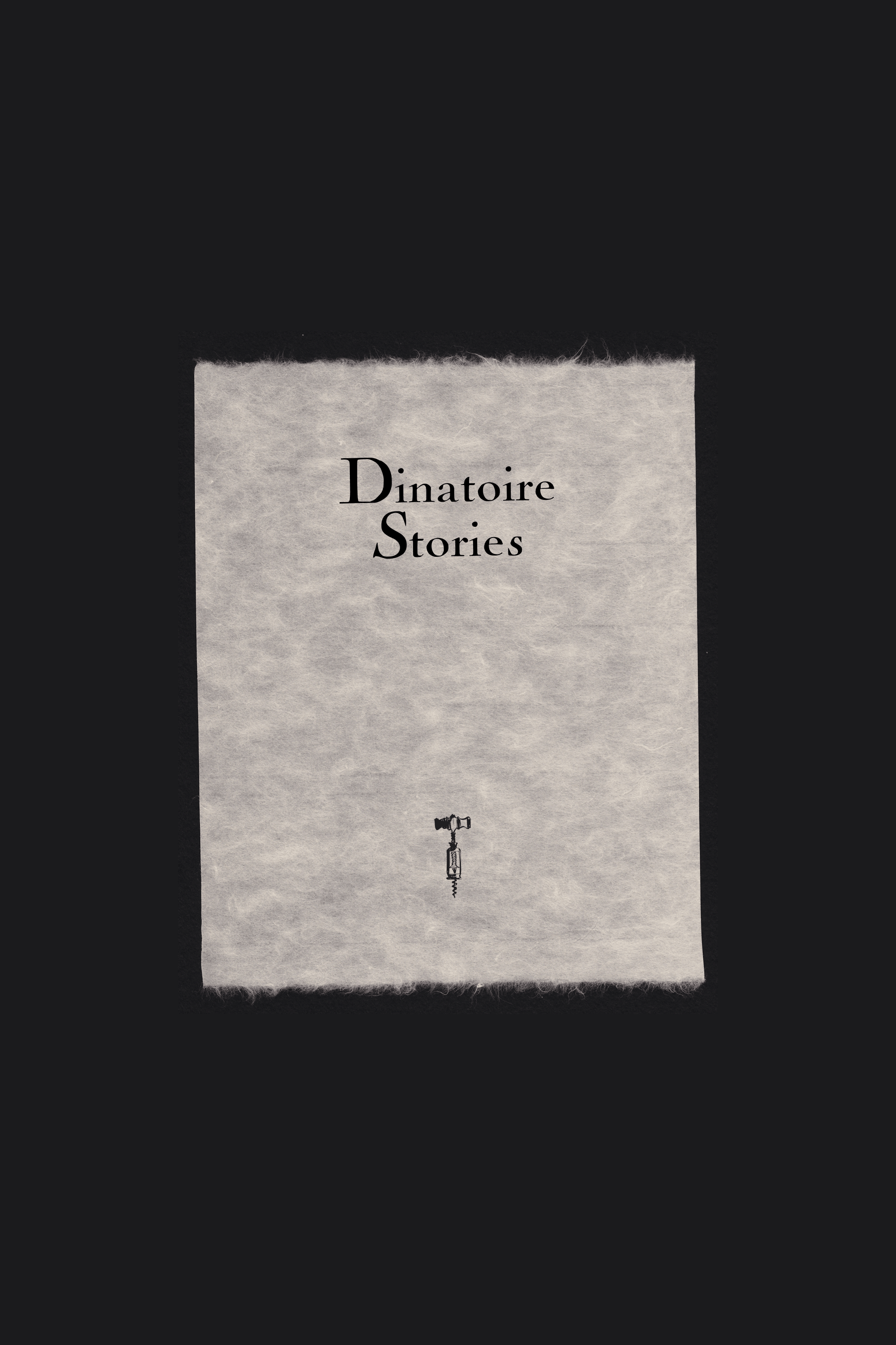 A torn-edge cotton paper card reading "Dinatoire Stories" with a cork screw icon, centered on a black background.
