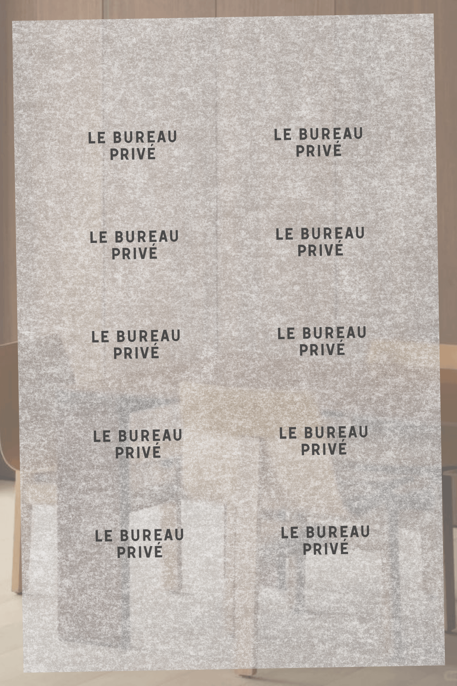 A sheet of translucent vellum paper repeatedly printed with the "Le Bureau Privé" wordmark in a grid pattern, layered over a blurred photo.