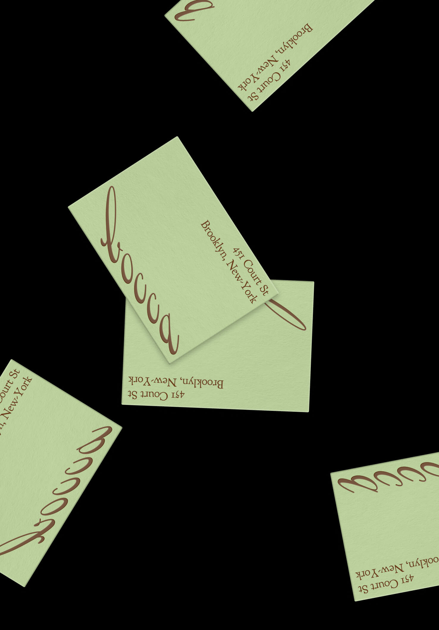 Scattered pale green business cards on a black background, each printed with the cursive "Bocca" logo and address in brown ink.