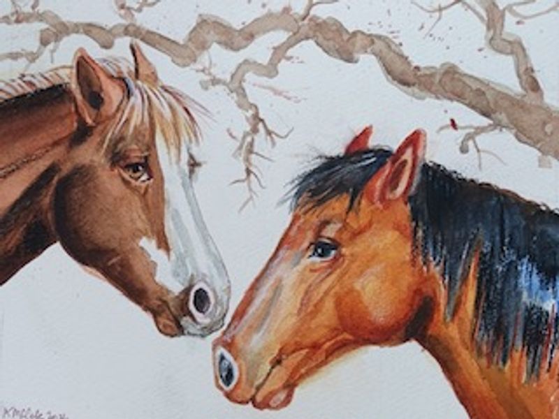Two friendly horses under a winter branch