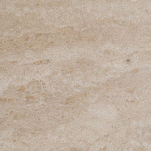 Mesa de comedor beige con efecto travertino, detalle del acabado del tablero
