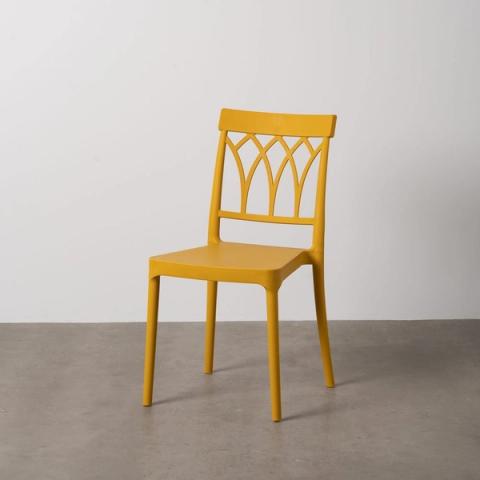 Silla apilable amarilla de respaldo calado