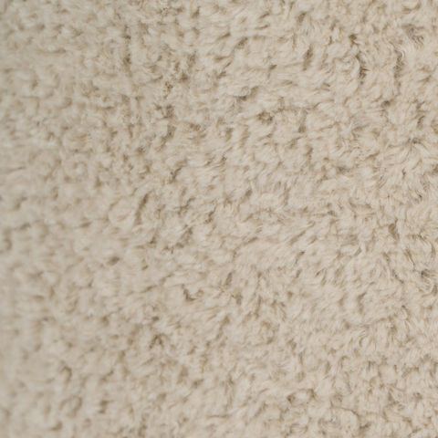 Detalle de la textura del tapizado beige