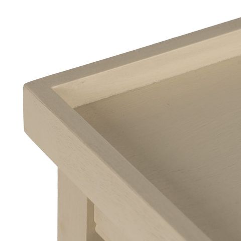 Consola crema con cajones y hueco abierto, detalle del acabado