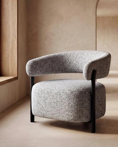Sillón gris tapizado de respaldo bajo