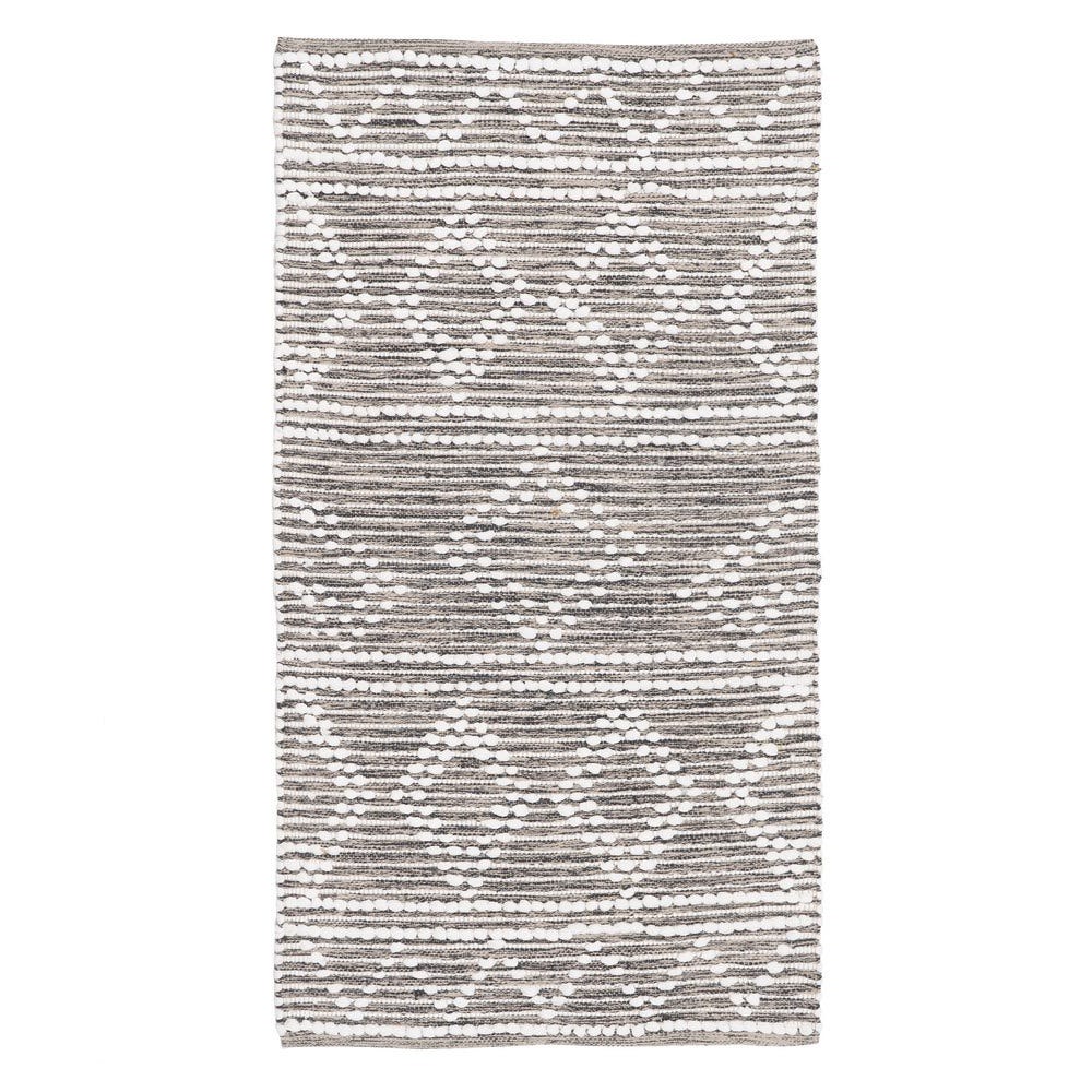 Alfombra gris y blanca de rombos con relieve — vista completa