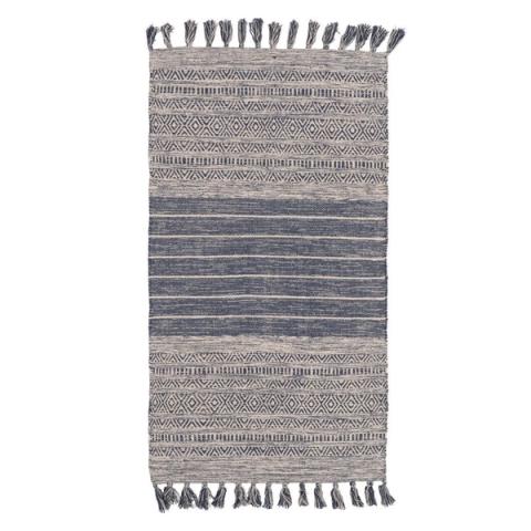 Alfombra azul y blanca con flecos — vista completa