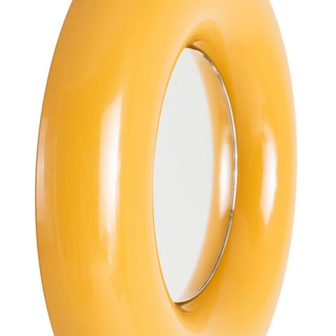 Detalle del marco de anillos concéntricos mostaza