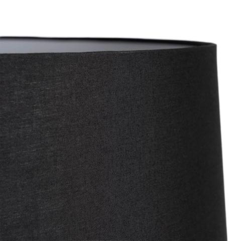Lámpara de pie negra con columna ondulada — detalle