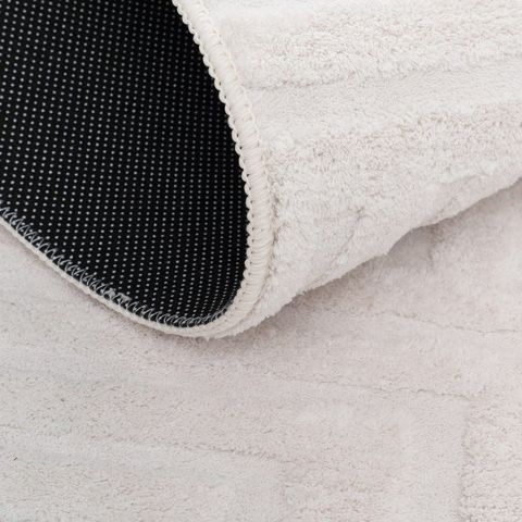Alfombra geométrica cruda de líneas — detalle