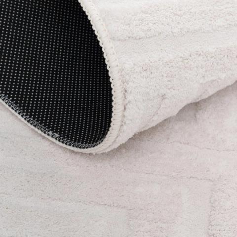 Alfombra geométrica cruda de líneas — detalle