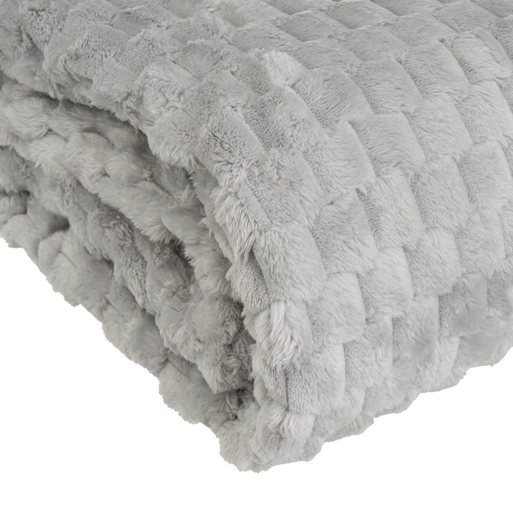 Manta gris de franela-jacquard doblada