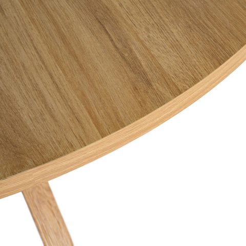 Mesa de comedor redonda con base cruzada, detalle del tablero