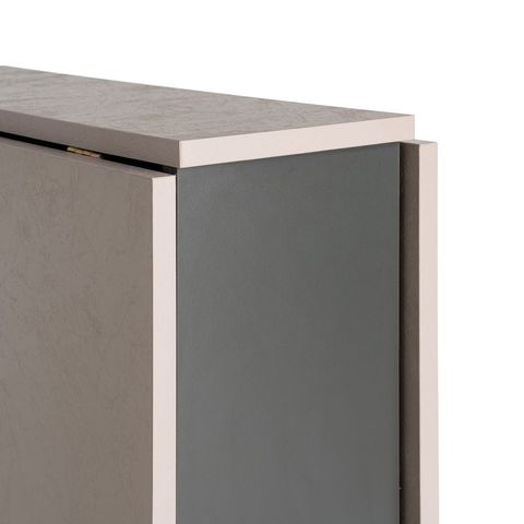 Mesa de comedor plegable en negro y crema, detalle del tablero