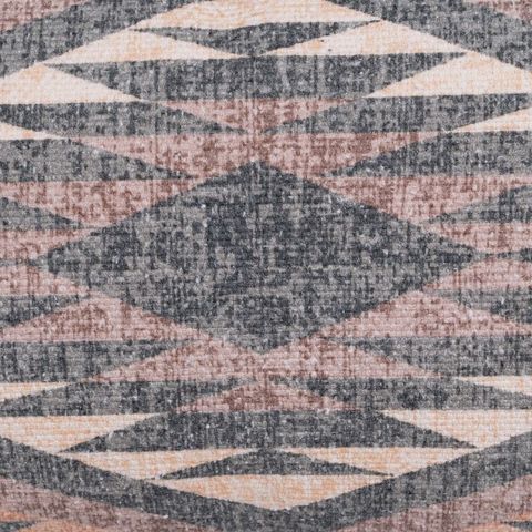 Cojín gris y rosa de rombos concéntricos — detalle