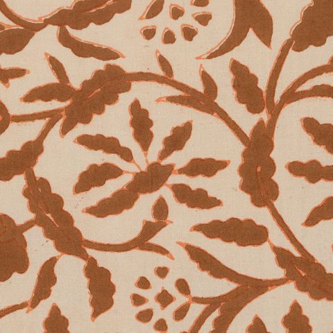 Cojín beige y marrón de flores — detalle