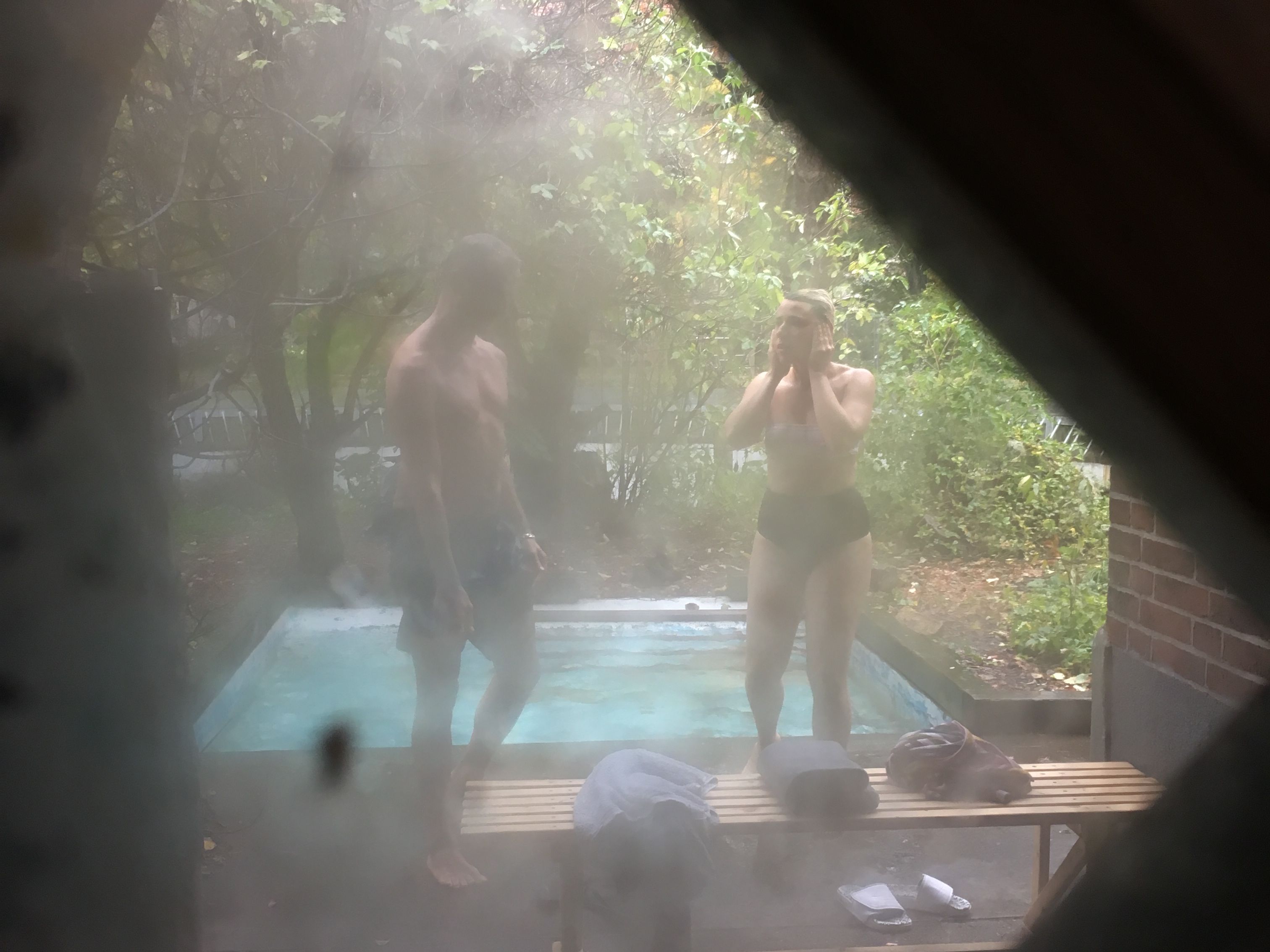 Participants bathing outside in bear pool after sauna in PPKK 03.00 by Sarah Ancelle Schoenfeld and Louis-Philippe Scoufaras at Baerenzwinger Berlin