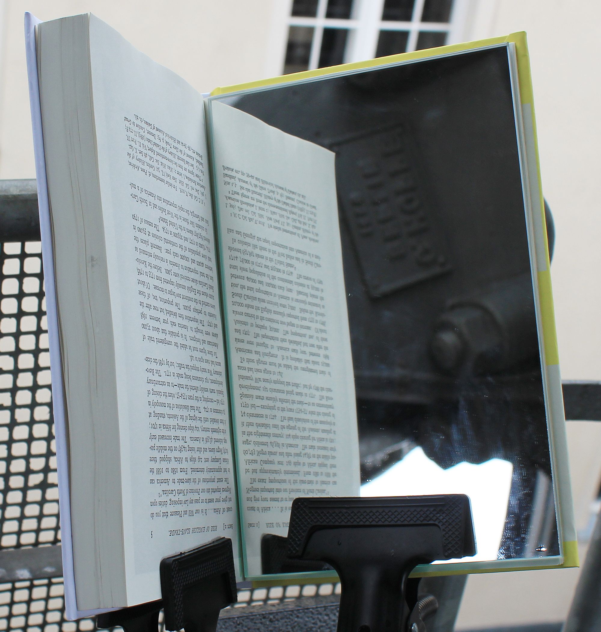 Close-up view of mirror in W. E. B Du Bois book for PPKK 07.00 by Sarah Ancelle Schoenfeld and Louis-Philippe Scoufaras at Archenhold Observatory Berlin