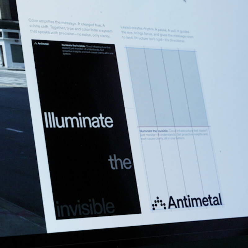 A video that cycles between design documentation which showcases Antimetal should use color and the grid to create typographic compositions and a real-world example of the two coming together in an out of home advertisement