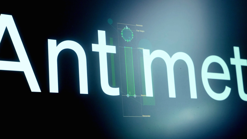 Footage of the Antimetal logomark and logotype being drawn as a variable typeface