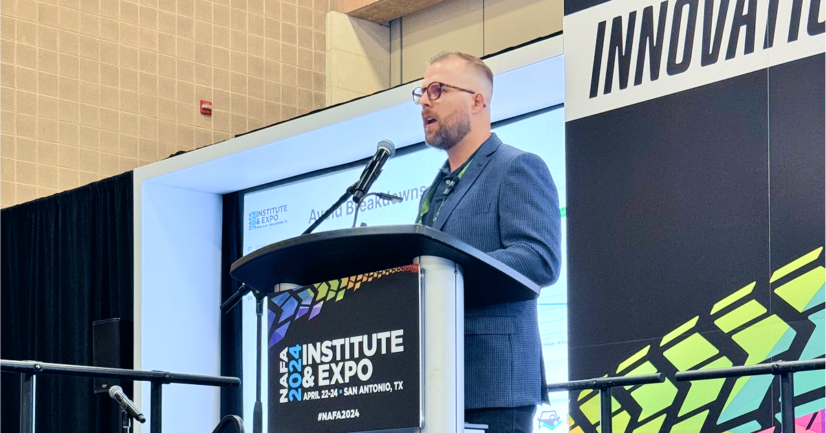 Panel discussion at the NAFA Fleet Management Association trade show, featuring industry experts sharing insights on fleet operations and technology trends.