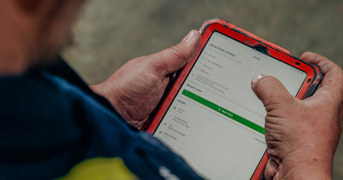 An employee of A&D Environmental handling a work order in Fleetio