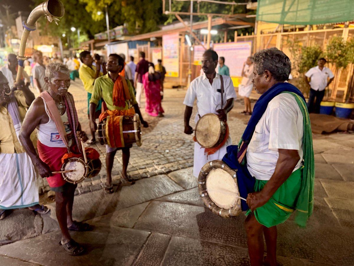 Temple musicians outside at night