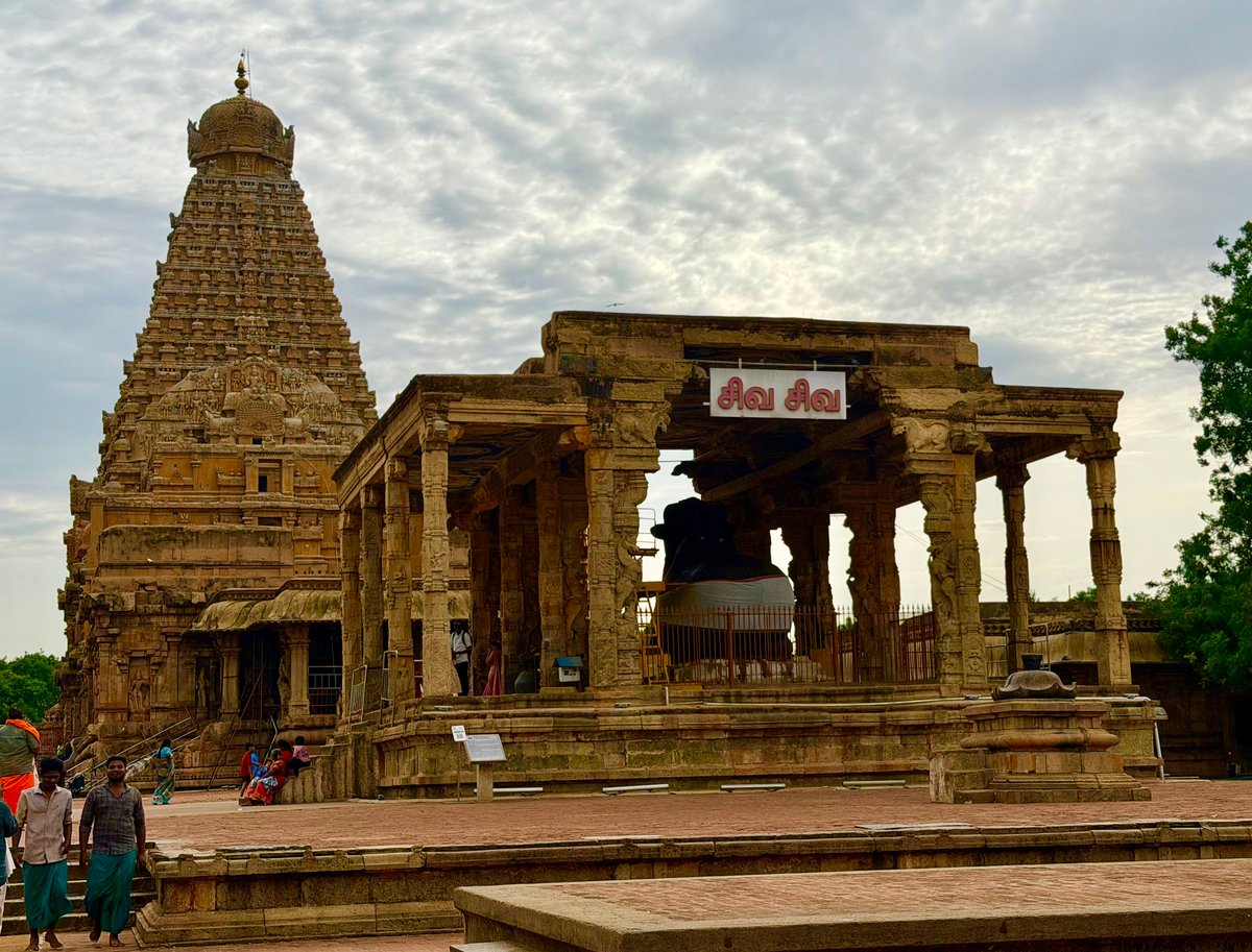 The great courtyard of Brihadeeswarar — the Nandi mandapam in the foreground, the 216-foot vimana rising behind it. The scale of this complex, built in 1010 CE, is staggering even before you step inside.