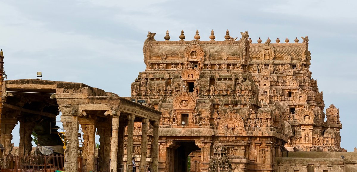 The Keralantakan gopuram — the outer gateway of Brihadeeswarar, built in a later era. Every tier is packed with carvings: gods, guardians, celestial dancers, and creatures that defy easy naming.