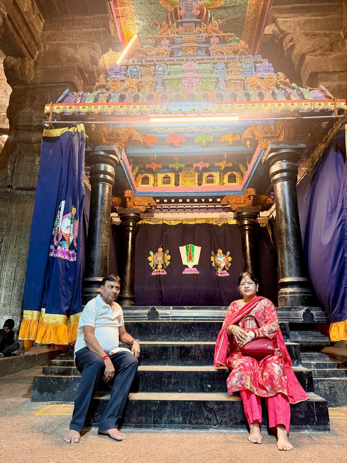 On the steps inside the temple