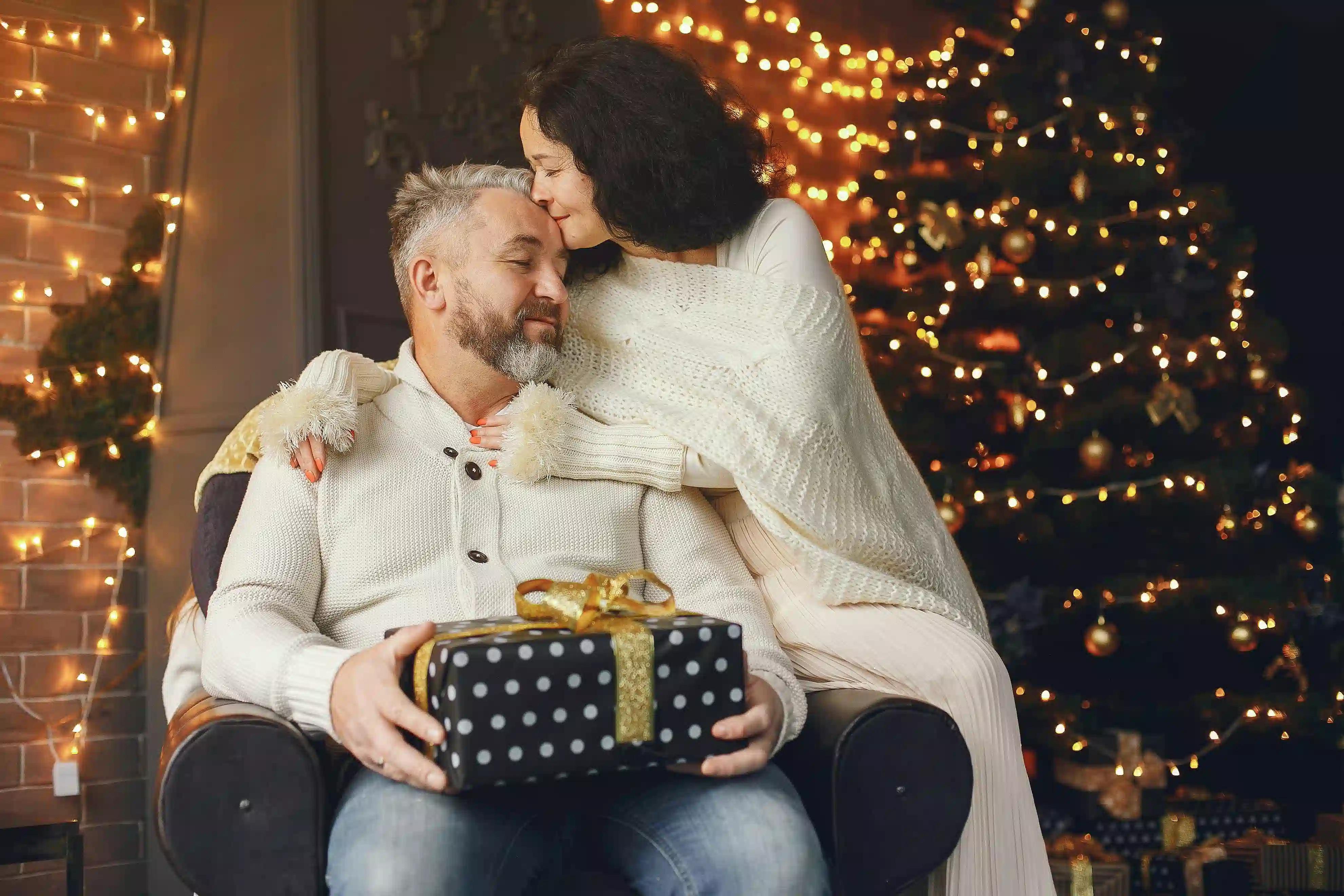 A wife giving a gift to her husband