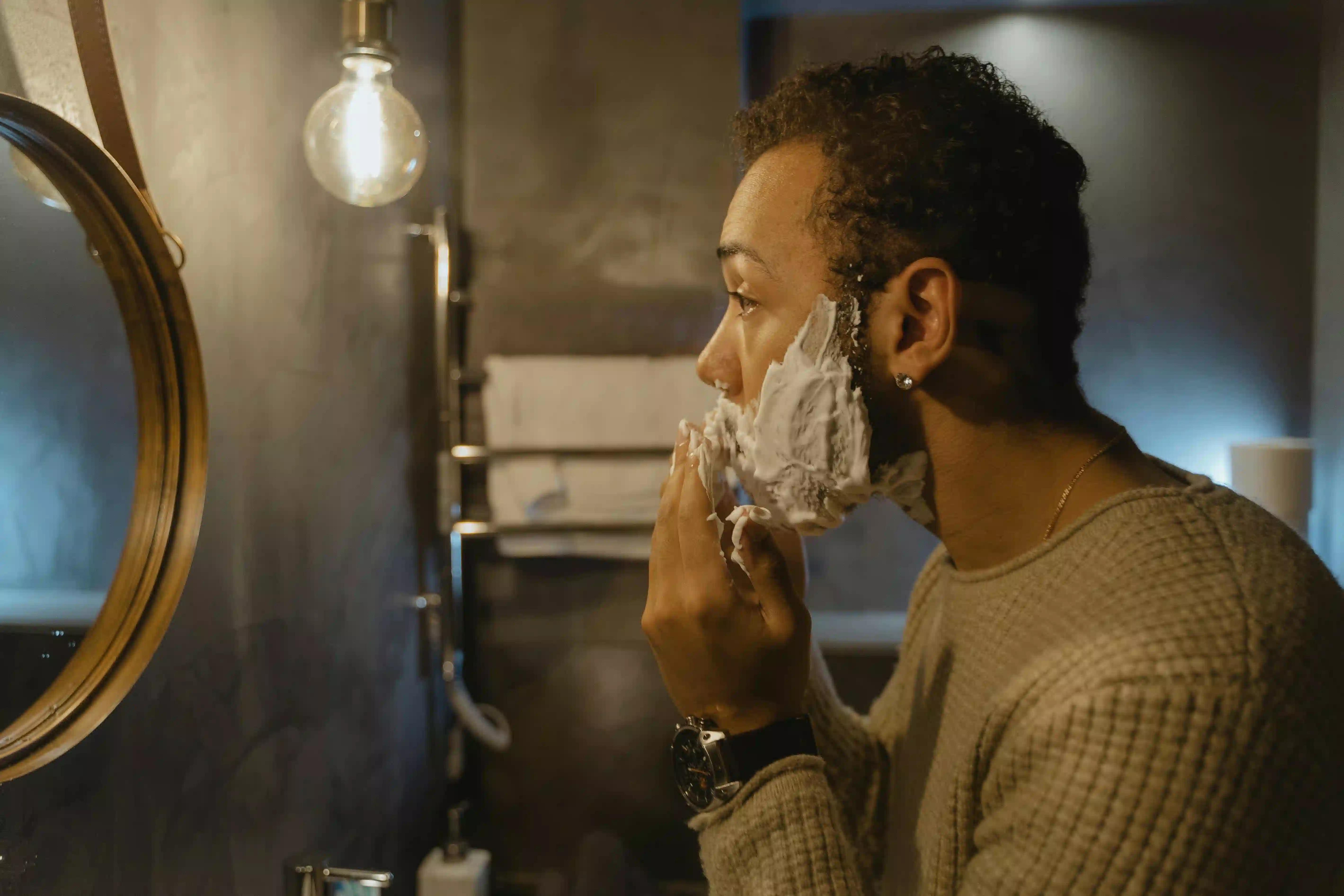 A man shaving his beard