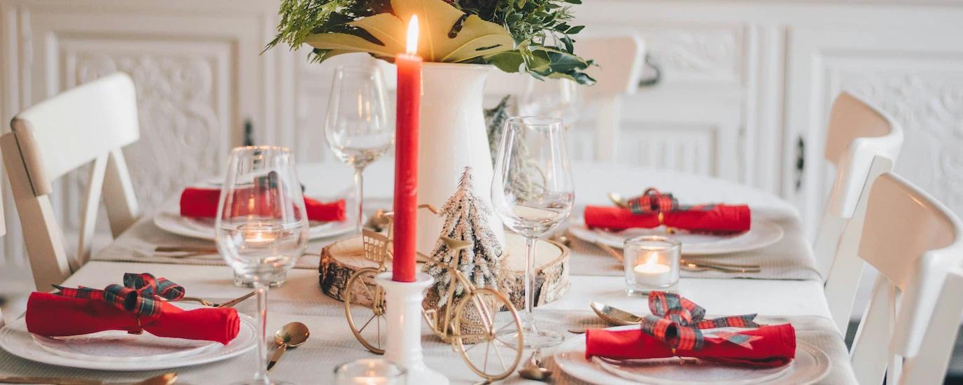 A festive Christmas table setting in red and white color palette 