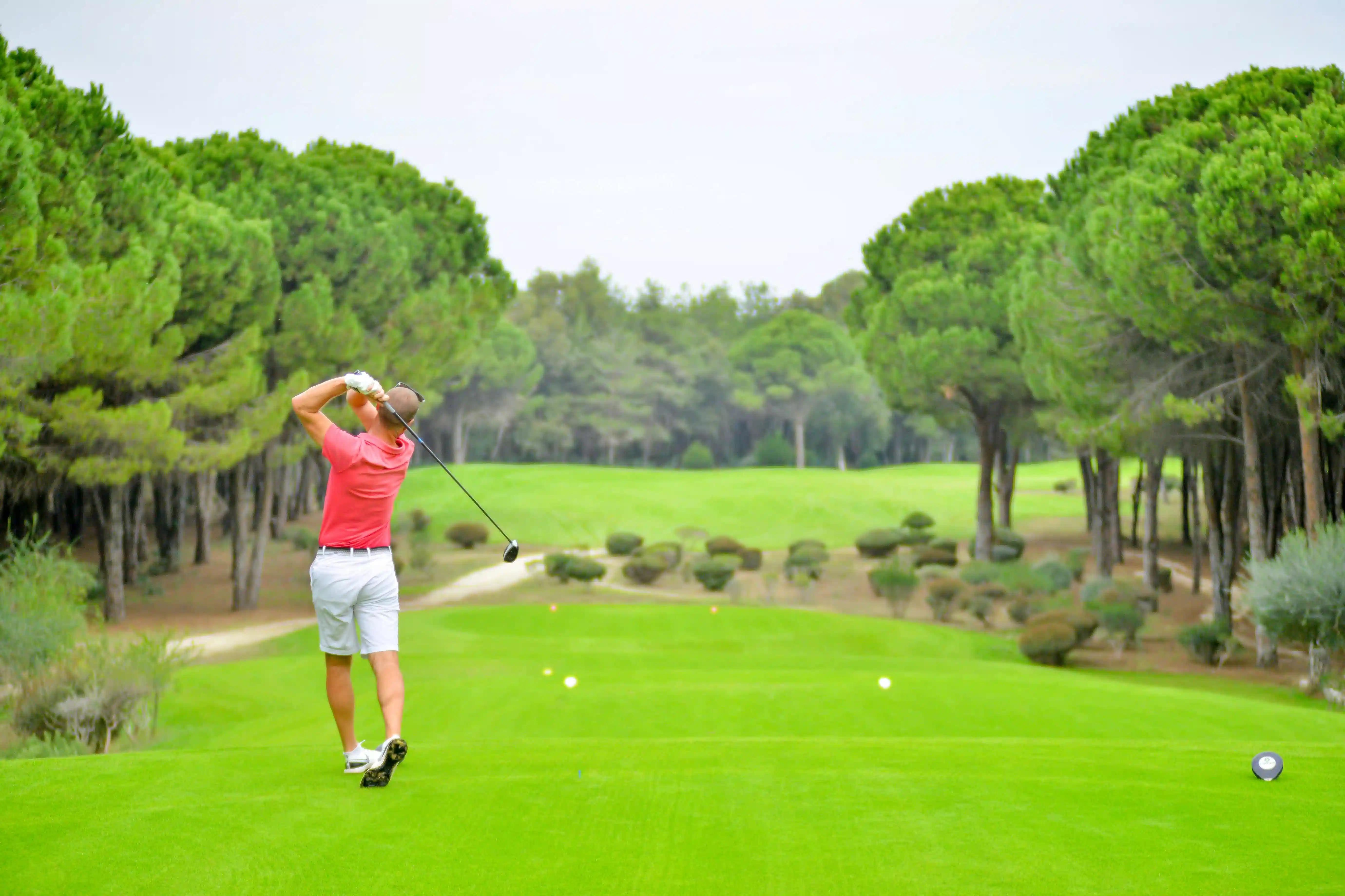 A man playing golf