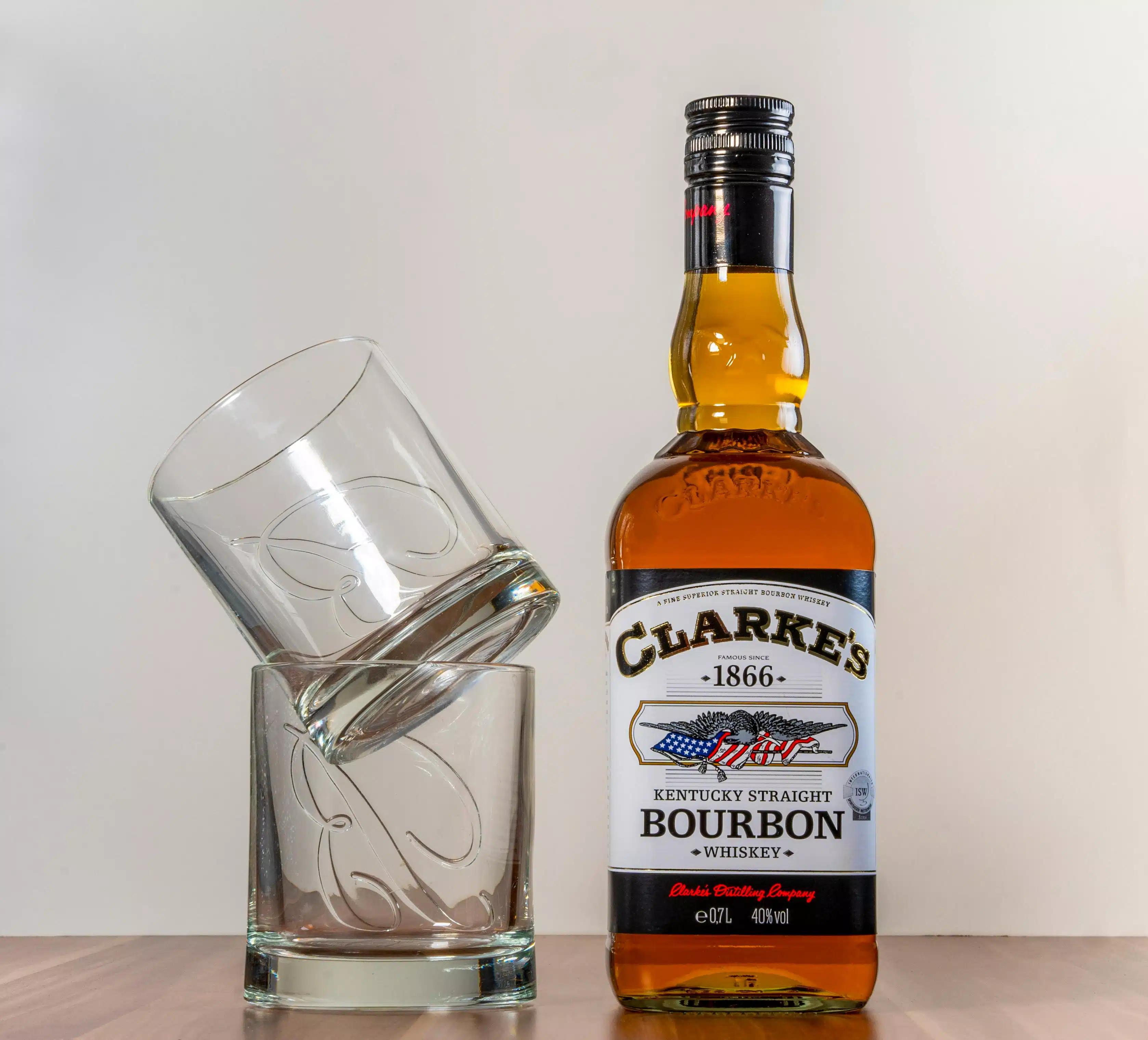 Whiskey glasses and a whiskey bottle