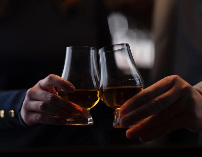Toasting whiskey glasses