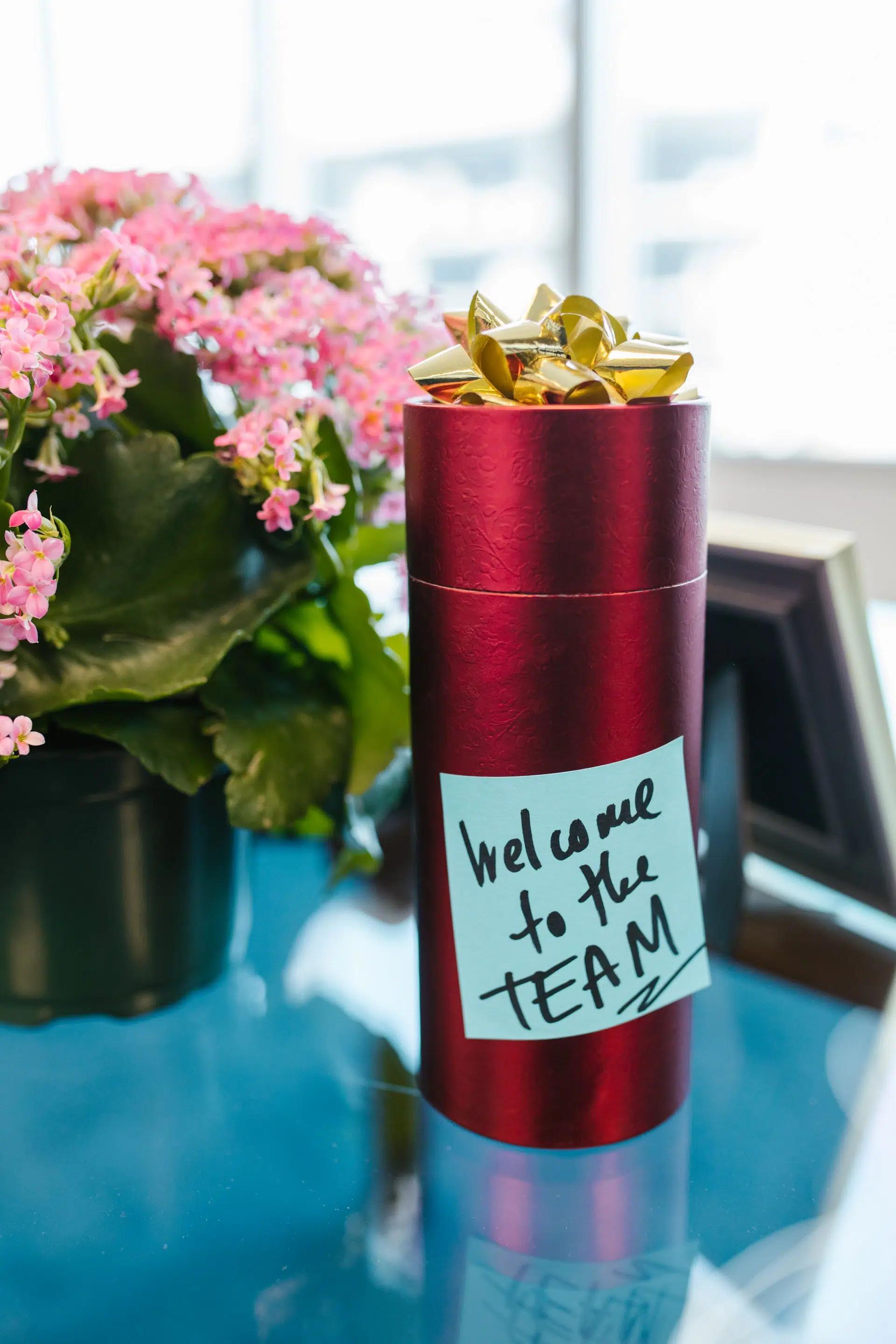 Welcome gift with note on office desk, ideal for new team members