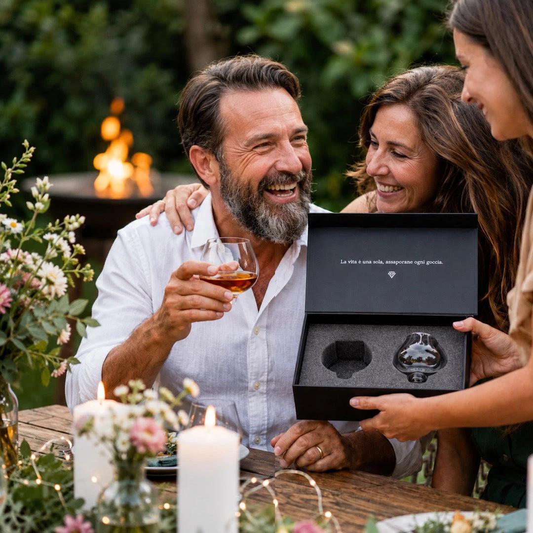 A man smiling while holding his Aequilibrium glass while a woman holds the gift box it came from