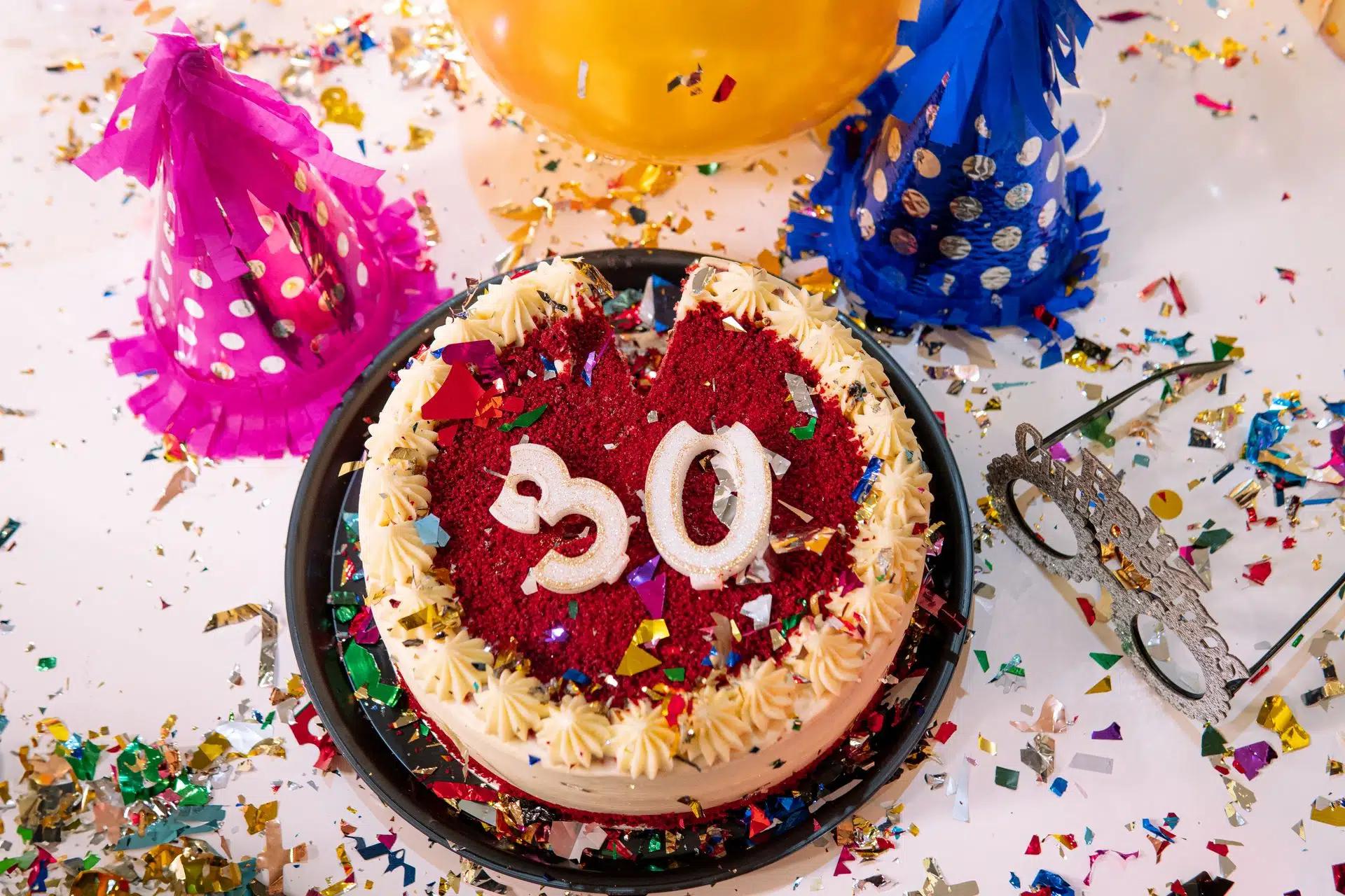 Vibrant 30th birthday party scene with cake, decorations, and confetti