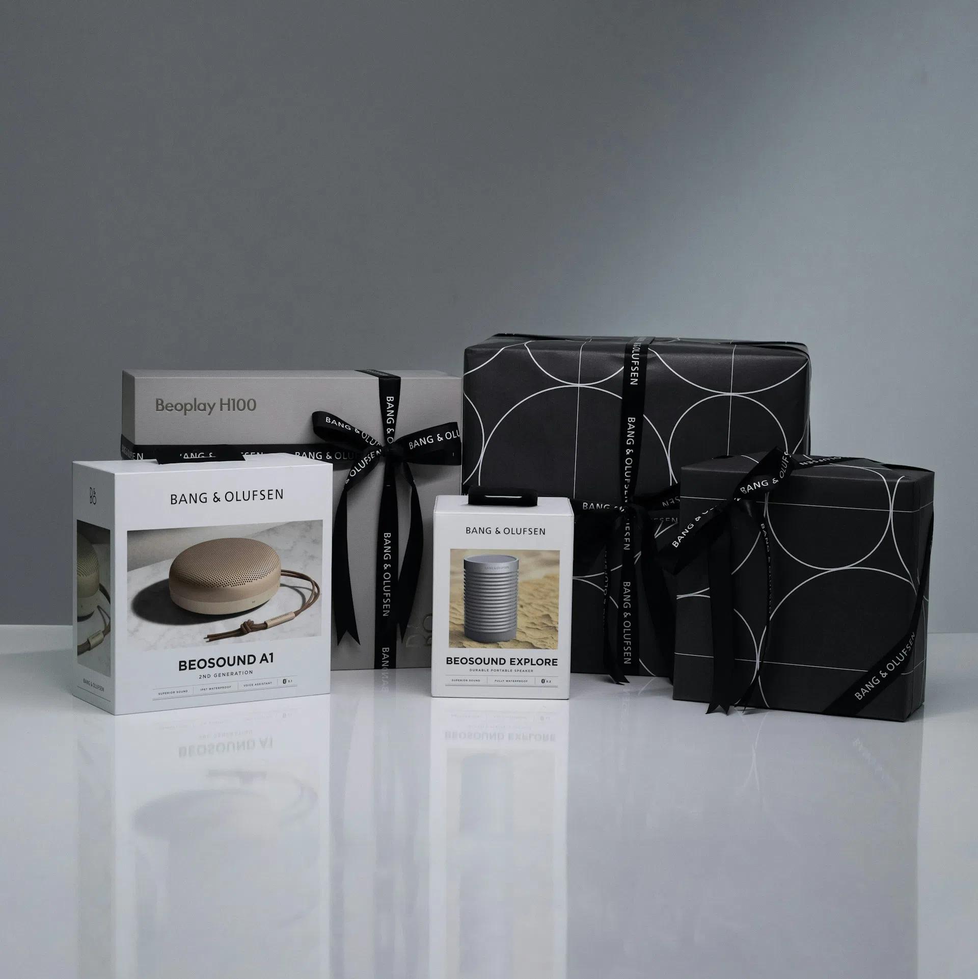 A lineup of Bang & Olufsen products in sophisticated packaging