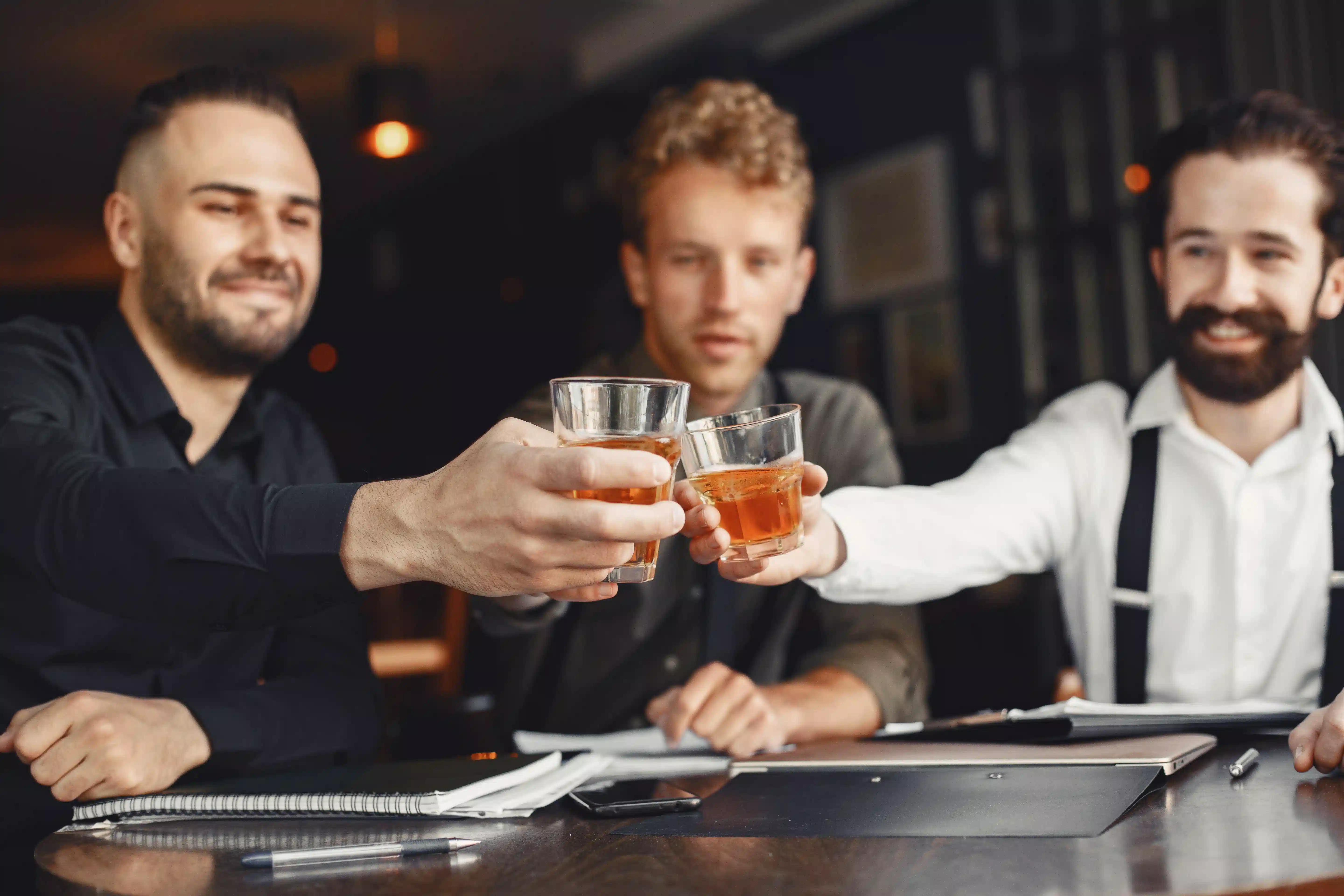 Men toasting whiskey
