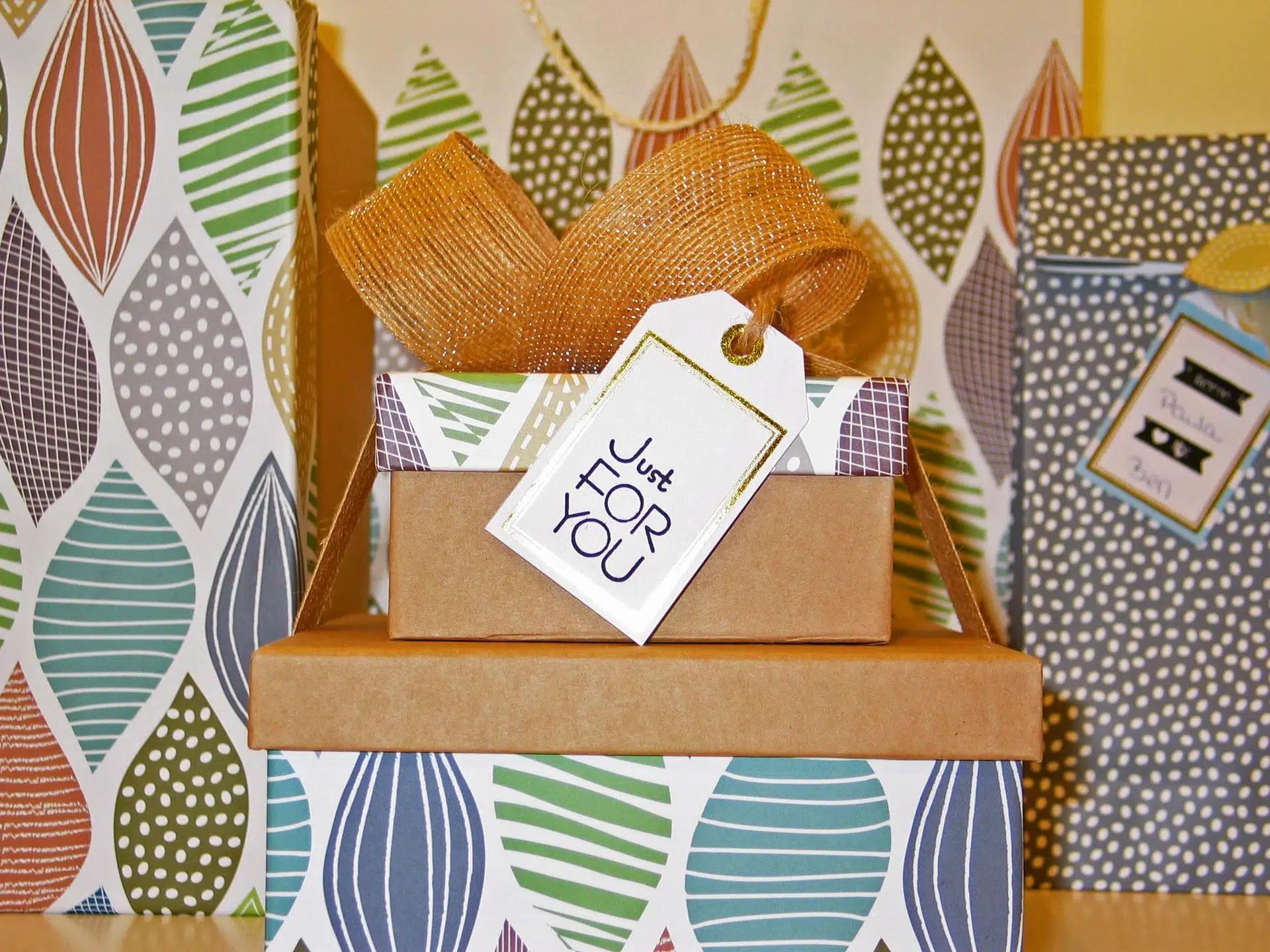 A stack of gifts in colorful box packaging