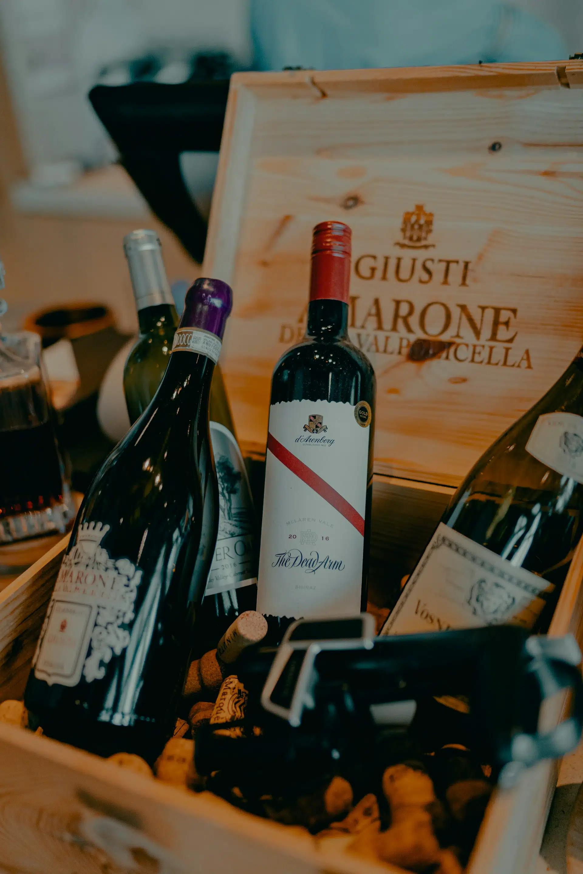 bottles of wine inside a wooden box