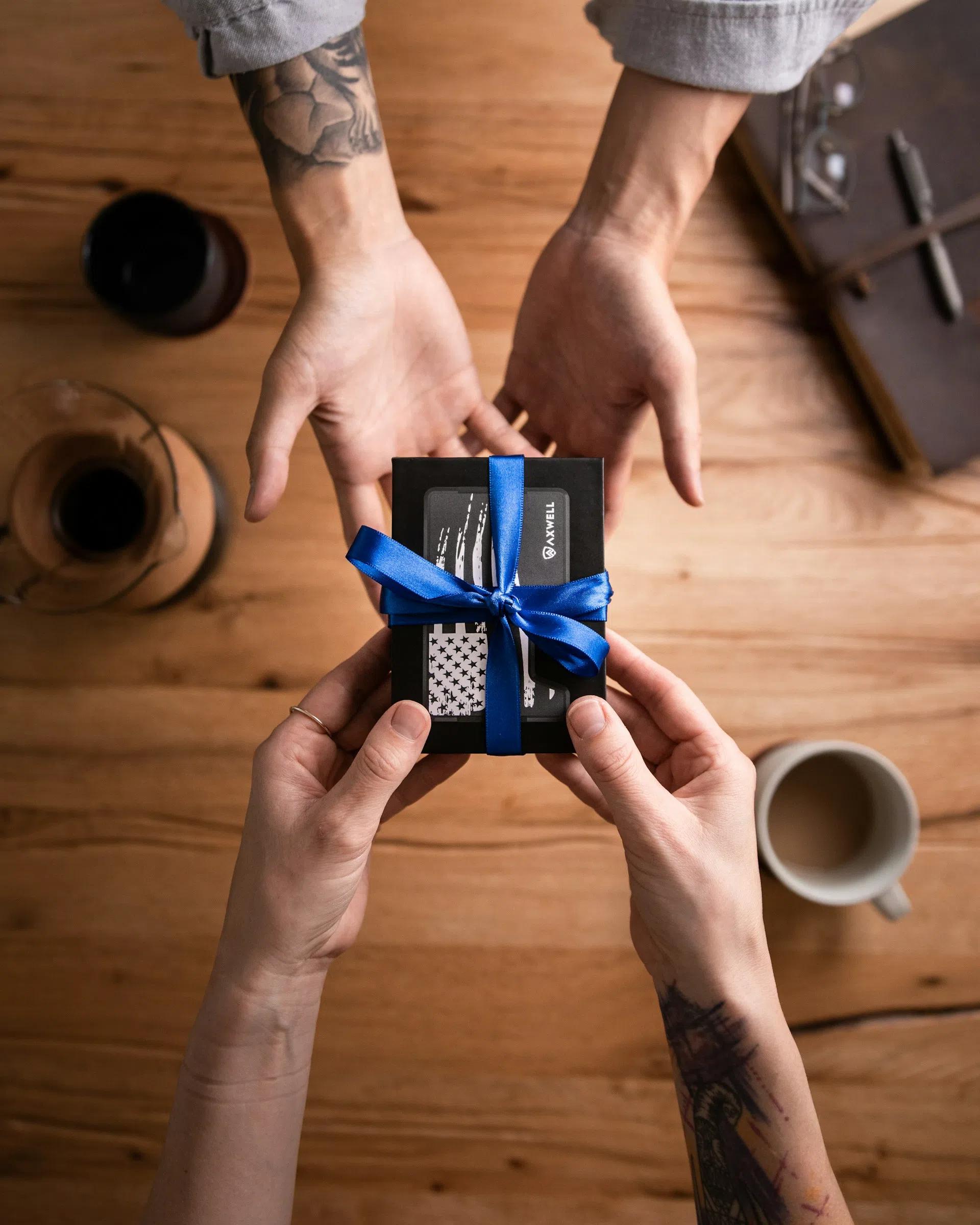 Overhead shot of a person handing over a gift to someone