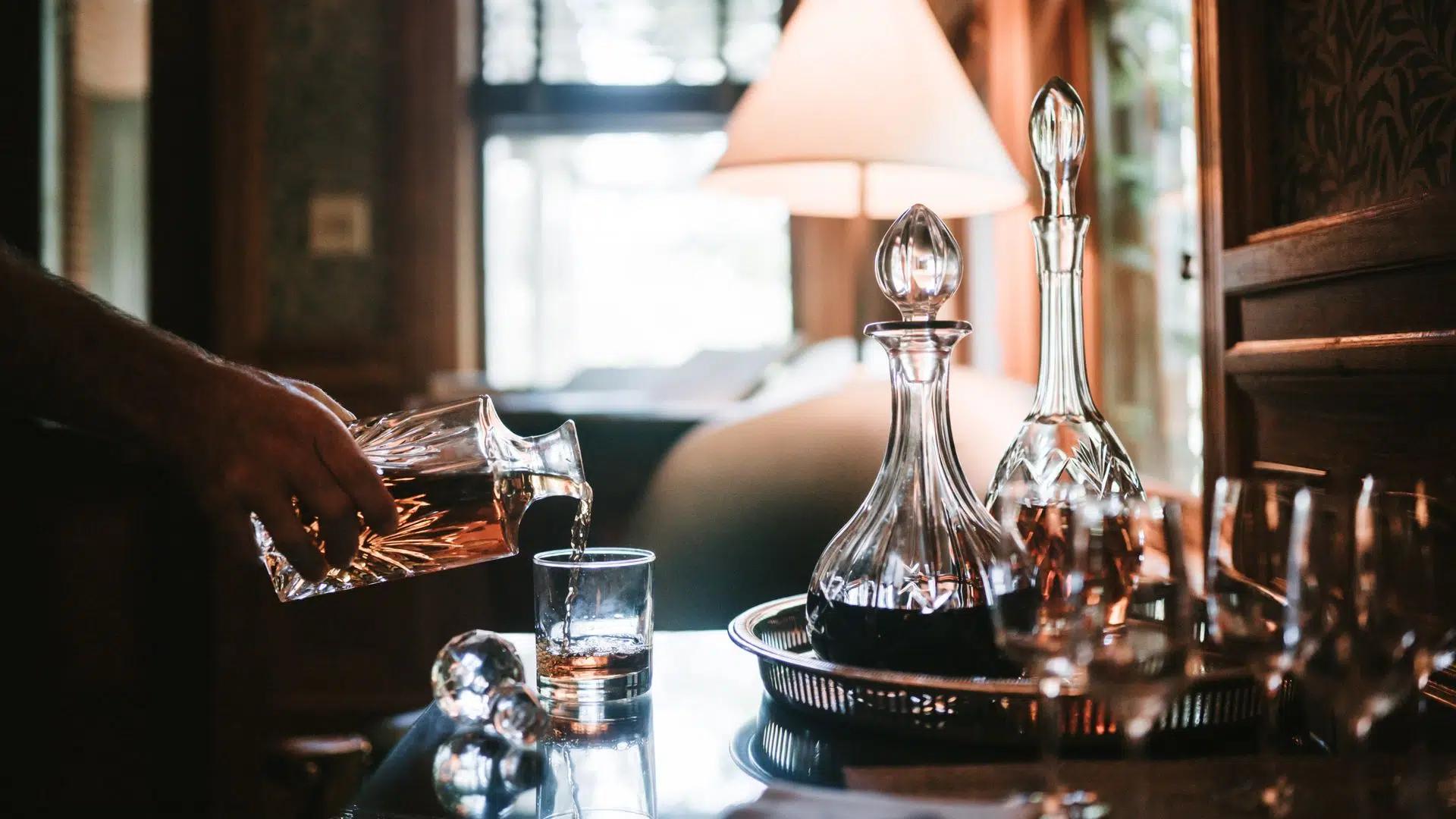 Pouring whiskey into a glass