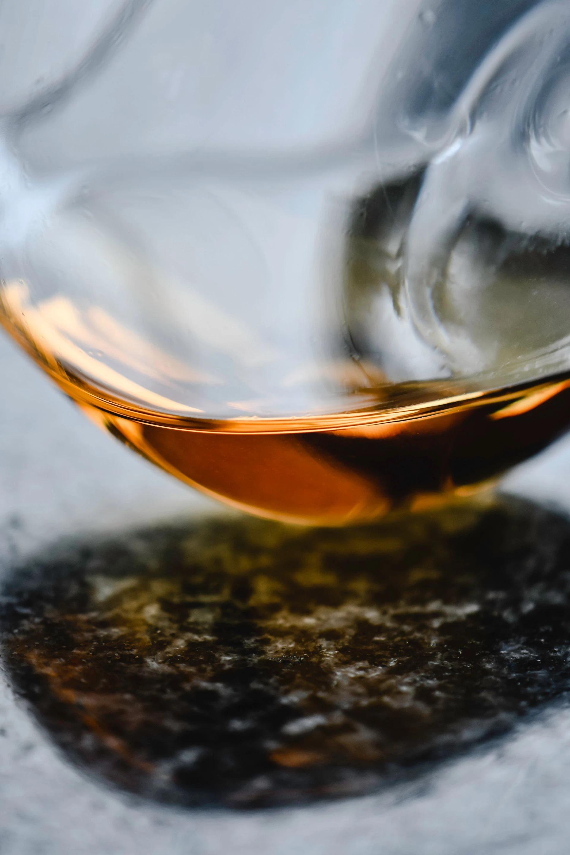 Closeup of a glass spinning at the base