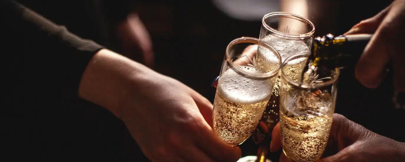 Pouring champagne into champagne flutes