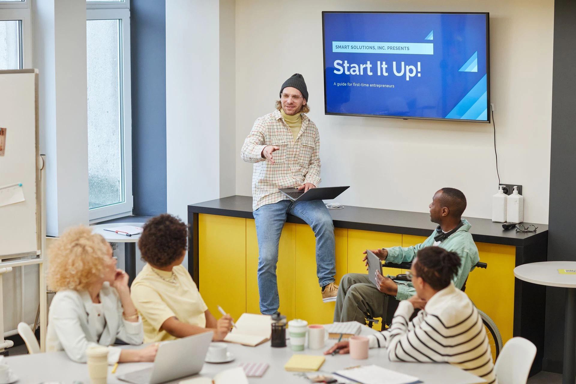 A diverse group in an office meeting discussing startup strategies and innovative ideas