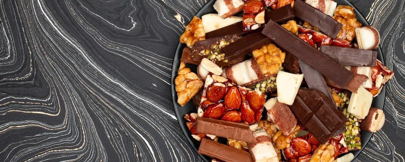 Gourmet food items on a round serving plate on a table